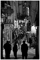 Pedestrian street with restaurants at night. Quartier Latin, Paris, France (black and white)