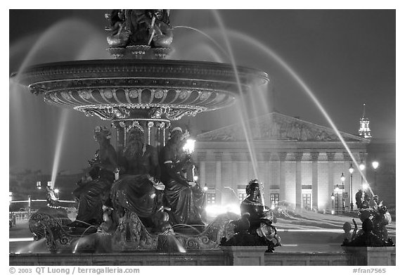 Fountain on Place de la Concorde and Assemblee Nationale by night. Paris, France