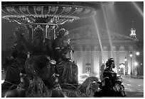 Fountain on Place de la Concorde and Assemblee Nationale by night. Paris, France ( black and white)