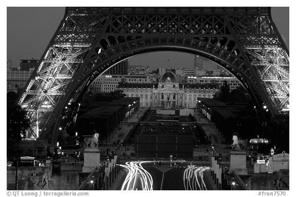 Ecole Militaire (Military Academy) seen through Tour Eiffel  at dusk. Paris, France