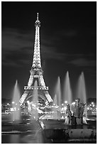 Tour Eiffel (Eiffel Tower) and Fountains on the Palais de Chaillot by night. Paris, France (black and white)