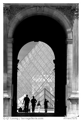 Pyramid seen through one of the Louvre's Gates. Paris, France