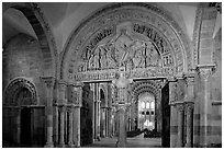 Sculpted doors and typhanum inside the Romanesque church of Vezelay. Burgundy, France (black and white)