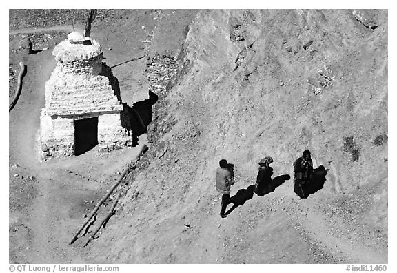 People ascending a trail past a chorten below Phuktal,  Zanskar, Jammu and Kashmir. India