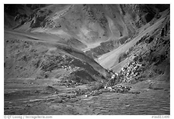 Cultivated fields, village, gompa, and barren mountains, Zanskar, Jammu and Kashmir. India