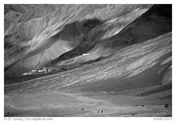 Barren hills with figures walking towards Karsha monastery, Zanskar, Jammu and Kashmir. India (black and white)