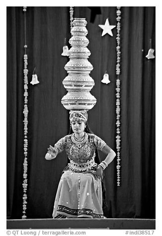 Rajasthani dancer balancing jars on head. New Delhi, India (black and white)