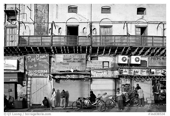 Street with old buildings and storefronts closed, Old Delhi. New Delhi, India