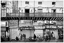 Street with old buildings and storefronts closed, Old Delhi. New Delhi, India ( black and white)