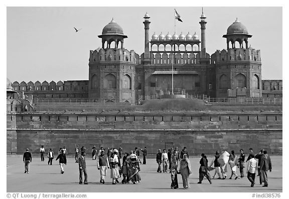 Tourists walking on esplanade in front of the Lahore Gate. New Delhi, India (black and white)