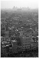 View of Old Delhi from above with high rise skyline in back. New Delhi, India (black and white)
