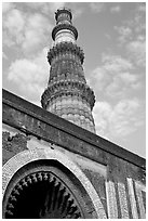 Alai Darweza gate and Qutb Minar tower. New Delhi, India (black and white)