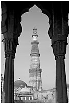 Qutb Minar tower framed by columns. New Delhi, India (black and white)