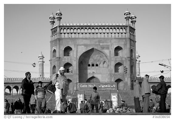 Early morning activity under Jama Masjid East Gate. New Delhi, India (black and white)