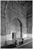 Muslim men praying, prayer hall, Jama Masjid. New Delhi, India (black and white)