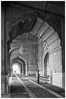 Muslim man in prayer, prayer hall, Jama Masjid. New Delhi, India (black and white)