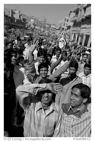 Young men walking in front of groom during a wedding procession. Jodhpur, Rajasthan, India