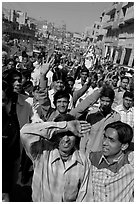 Young men walking in front of groom during a wedding procession. Jodhpur, Rajasthan, India (black and white)