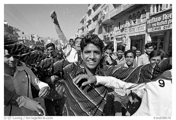 Young men celebrating during wedding procession. Jodhpur, Rajasthan, India