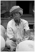 Man with turban holding a jar. Jodhpur, Rajasthan, India (black and white)