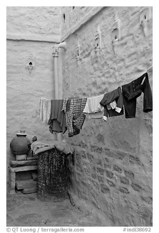 Laundry in alley with whitewashed walls tinted indigo. Jodhpur, Rajasthan, India