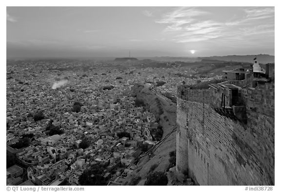 Mehrangarh Fort walls, blue houses, and setting sun. Jodhpur, Rajasthan, India (black and white)