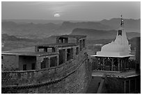 Sun setting over the Chamunda Devi temple, Mehrangarh Fort. Jodhpur, Rajasthan, India (black and white)