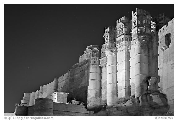 Towers and 36m high walls of Mehrangarh Fort by night. Jodhpur, Rajasthan, India (black and white)