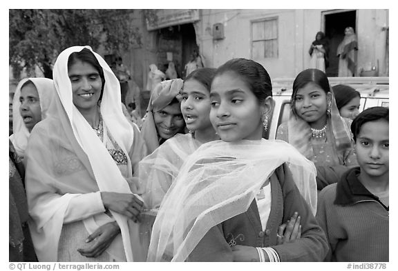 Women standing in the street during a wedding. Jodhpur, Rajasthan, India (black and white)