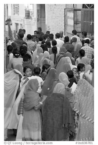 Narrow street filled by wedding procession. Jodhpur, Rajasthan, India