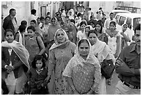 Old town street with wedding procession. Jodhpur, Rajasthan, India (black and white)