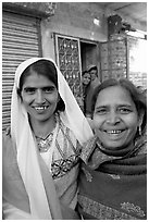 Smiling women in old street. Jodhpur, Rajasthan, India (black and white)