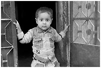 Boy in doorway. Jodhpur, Rajasthan, India (black and white)