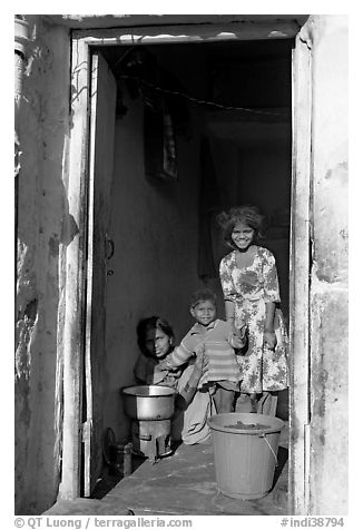 Family inside doorway. Jodhpur, Rajasthan, India