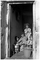 Family inside doorway. Jodhpur, Rajasthan, India (black and white)