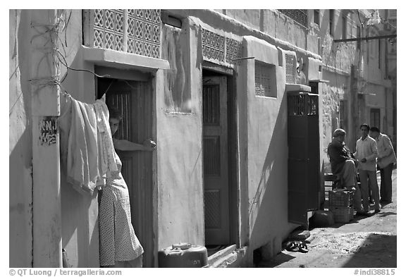 Sunlit street with blue house. Jodhpur, Rajasthan, India