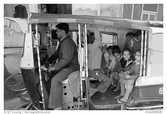 Rickshaw transporting schoolchildren. Jodhpur, Rajasthan, India (black and white)