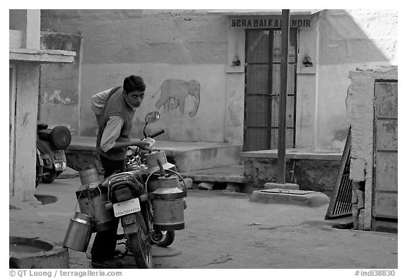 Man with milk delivery motorbike. Jodhpur, Rajasthan, India