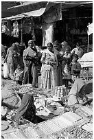 Women looking at jewelry stand in Sardar market. Jodhpur, Rajasthan, India (black and white)