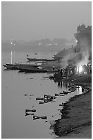 Cremation at Harishchandra Ghat at sunset. Varanasi, Uttar Pradesh, India (black and white)