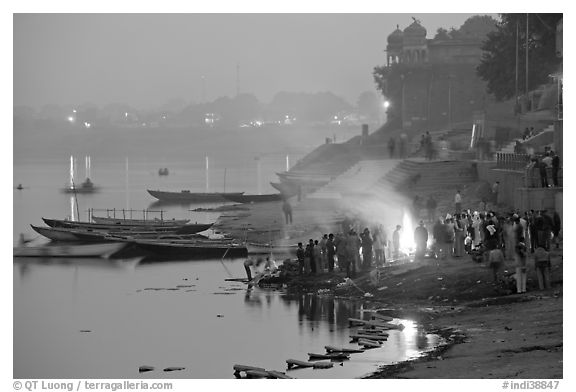 Cremation fire on banks of Ganges River. Varanasi, Uttar Pradesh, India (black and white)