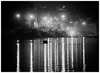 Ganges River at night with Ghat lights  reflected. Varanasi, Uttar Pradesh, India (black and white)