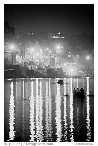 Lights reflected in the Ganga River at night. Varanasi, Uttar Pradesh, India (black and white)