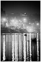 Lights reflected in the Ganga River at night. Varanasi, Uttar Pradesh, India (black and white)