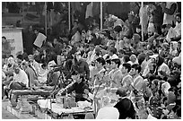 Brahmans standing amongst crowd at the begining of evening puja. Varanasi, Uttar Pradesh, India ( black and white)