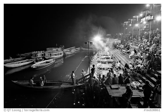 Boat and Dasaswamedh Ghat at the start of evening puja. Varanasi, Uttar Pradesh, India (black and white)