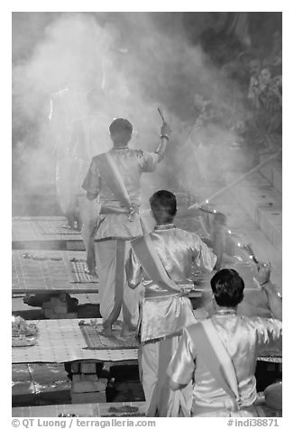 Brahmans standing amongst clouds of incense during puja. Varanasi, Uttar Pradesh, India (black and white)