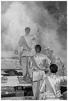 Brahmans standing amongst clouds of incense during puja. Varanasi, Uttar Pradesh, India (black and white)