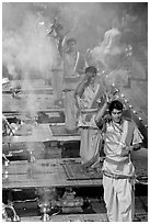 Five young Brahmans performing puja ceremony in the evening. Varanasi, Uttar Pradesh, India ( black and white)