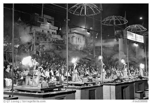 Pujari (priests) performing arti ceremony in front of large attendance. Varanasi, Uttar Pradesh, India (black and white)